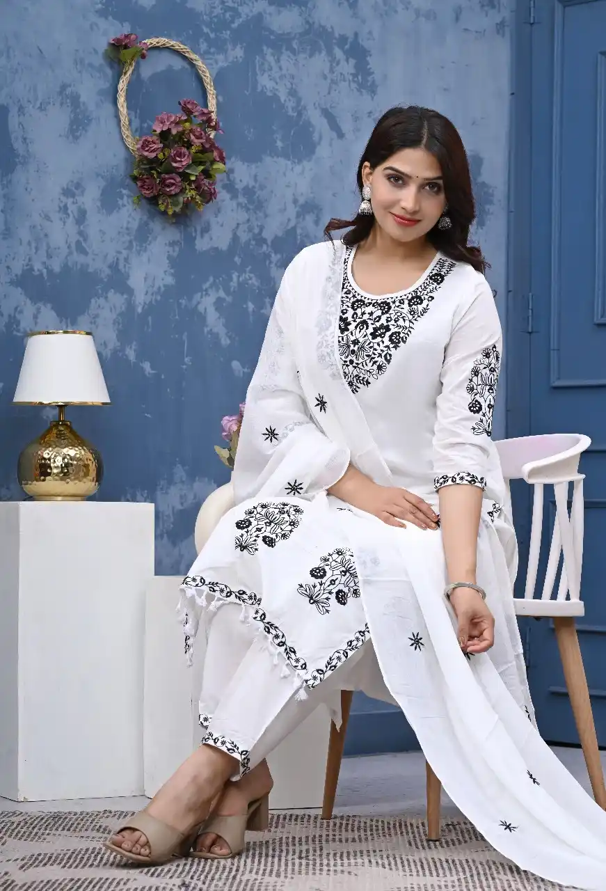 White kurta set with black embroidery.png